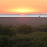 Sunset at Sunset Beach CA seen from the Bolsa Chica Wildlife Preserve
