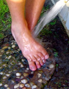 If possible, rinse your feet and rub them gently before going in your's or a friend's house