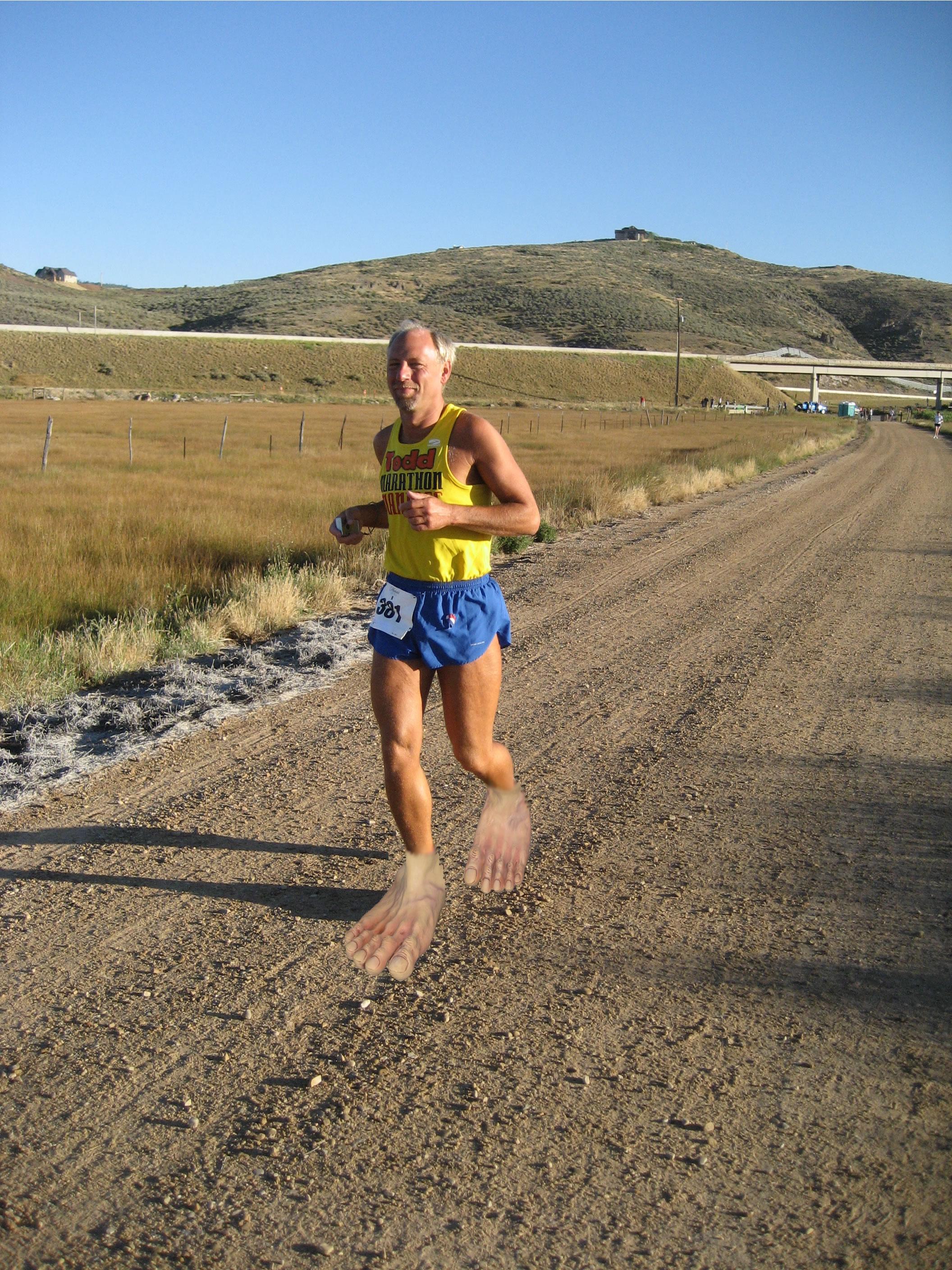Todd with fake bare feet photo-edited over his shoes. 'Barefoot Shoes?' I don't understand why Todd didn't run this 8-mile section of gravel barefoot (2007-08-25) Park City Marathon UT.