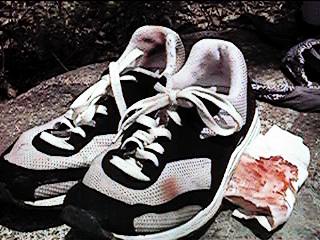 Ken Bob's bloody shoes after 18 miles (1998 May 10) Silverado Canyon, Orange CA - bloody napkin was from another runner who fell downhill on the gravel trails (possibly after tripping over a shoelace?)