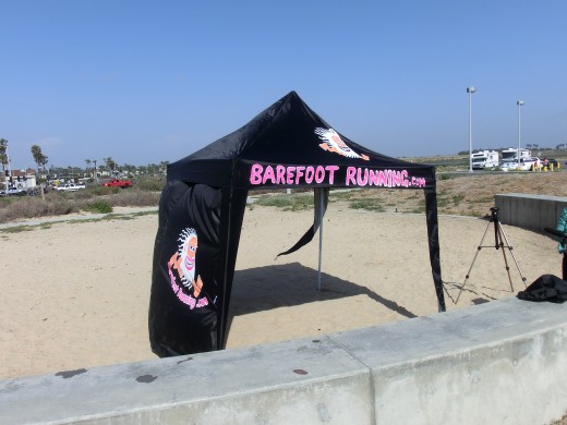Look for a black canopy with BarefootRunning.com in hot pink letters