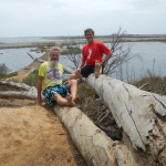 Ken Bob and Jacobus resting on logs